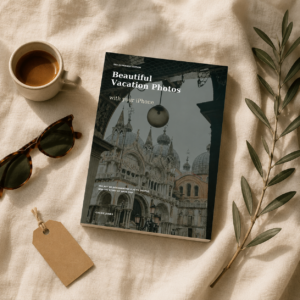 Flat lay of the Beautiful Vacation Photos with Your iPhone guide beside espresso, glasses and an olive branch.